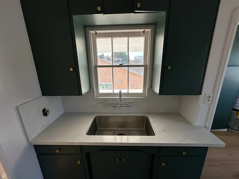 spacious counter top, sink, and storage