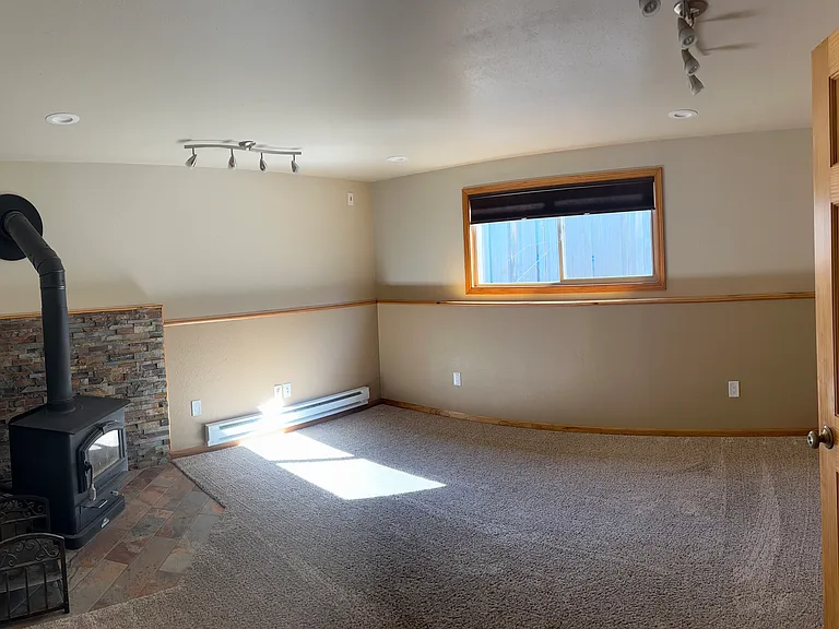 Downstairs living room with wood stove