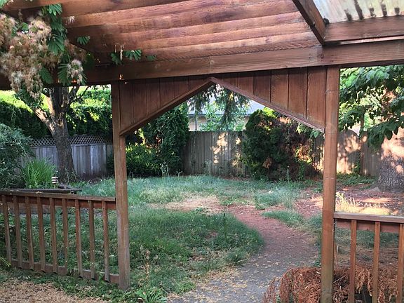 landscaped yard with shed