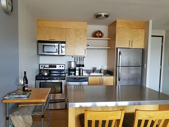 Well appointed kitchen with stainless steel appliances
