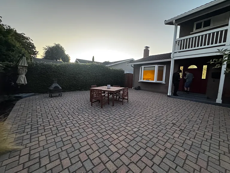 Front fenced paved patio