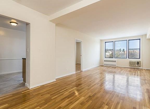 Welcome to your Junior 4 co-op featuring a living room with gleaming hardwood floors.