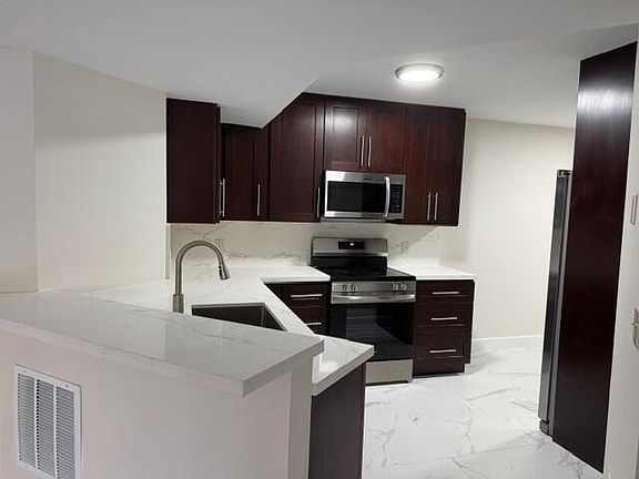 4th image of 8801 Wiles Rd APT 107