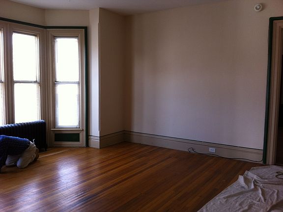 Family room with bay window overlooking side yard.
