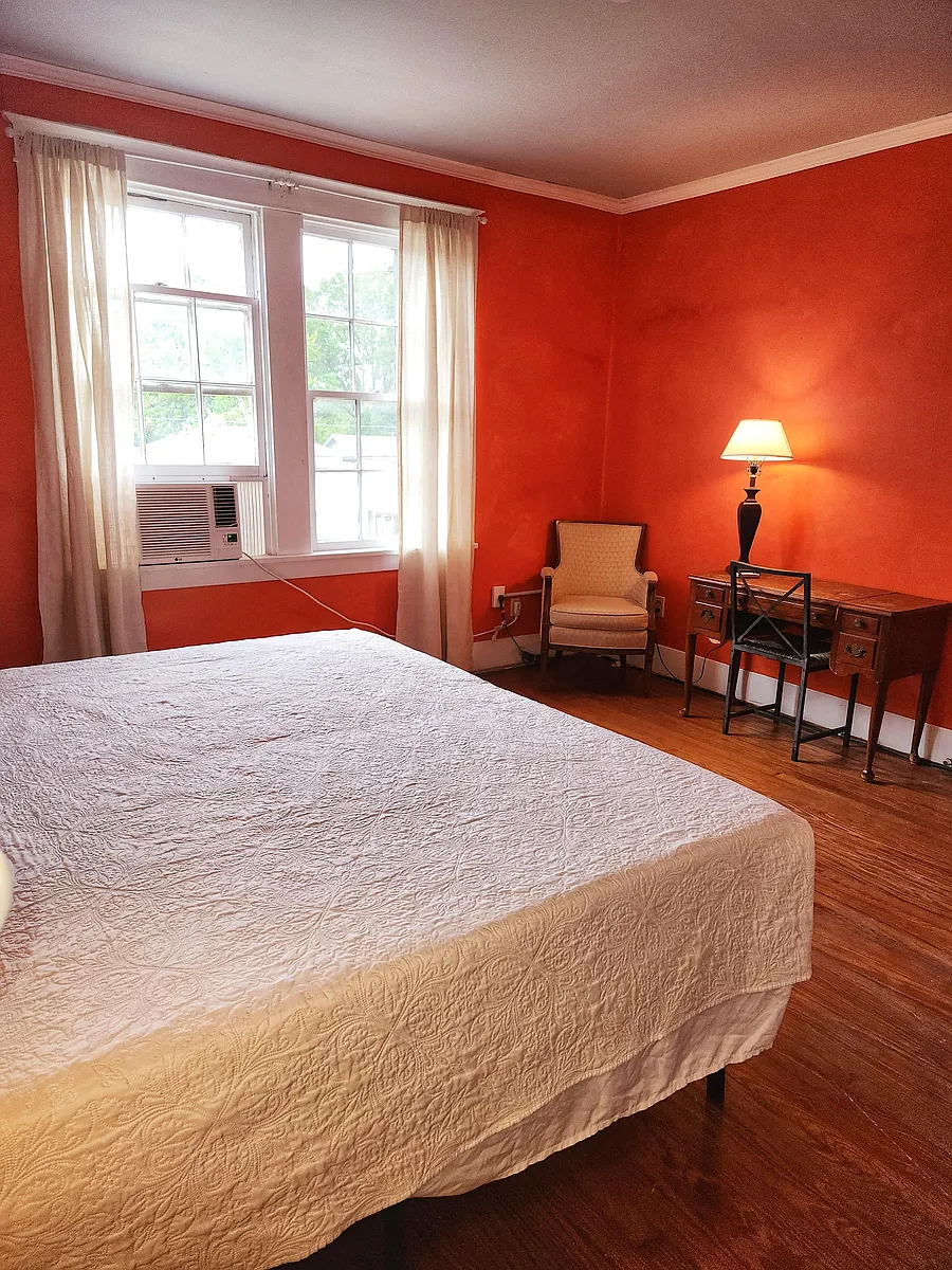 2nd Floor Orange Side yard view, 2 windows, King bed, dresser, wood floor, window AC/Heat unit, dedicated work station, NO TV - Delphine St