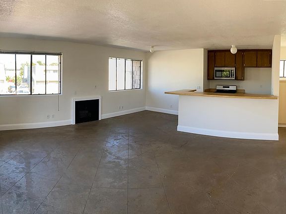 Panoramic view from front door. Gas fireplace is between the windows on the far wall.