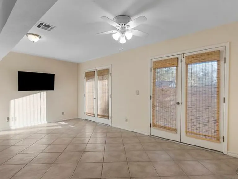 Ground level 2nd living or 3rd bedroom. Access to outdoor patio, Private full bathroom.