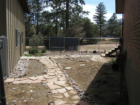 garden area between rv garage & house