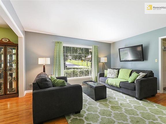 The formal living room is at the front of the home off the foyer. Beautiful paint colors throughout, as well as gorgeous hardwood floors.
