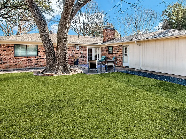 Fully Fenced Backyard with attached 2 Car Garage & BBQ Grill.