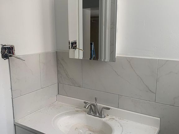 New bathroom with marble tiling! (Not yet finished/cleaned in the photo)