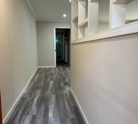 Entrance way leading to living room.