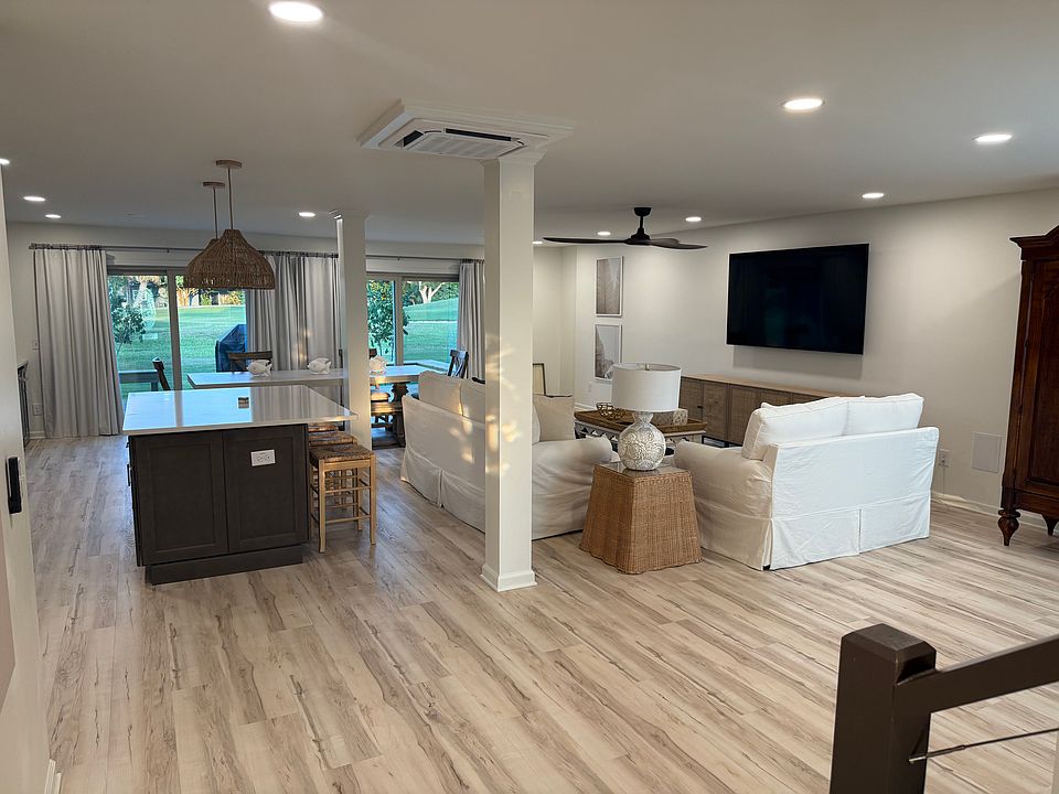 View walking in from Front Door into the Living Area and Kitchen
