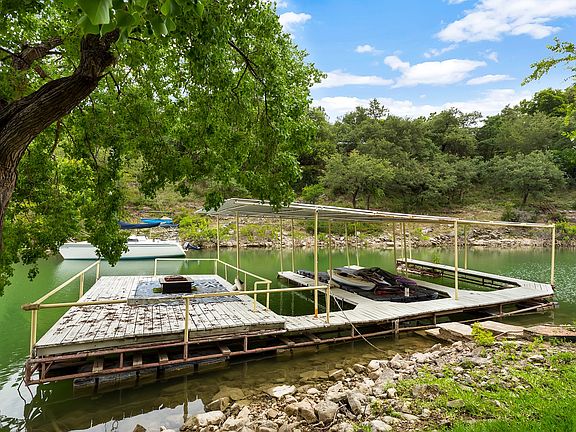 Private 3 slip boat dock with large deck area