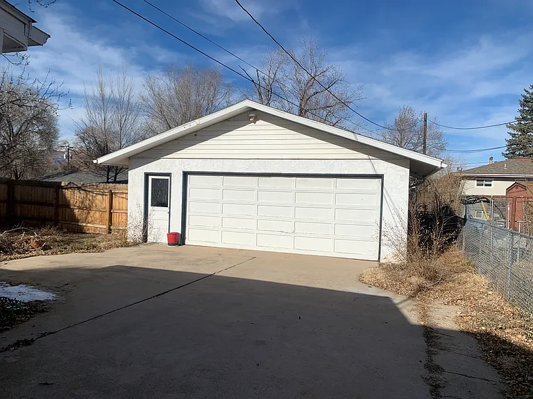 Oversized 2 car garage with work bench. Park out of the elements.