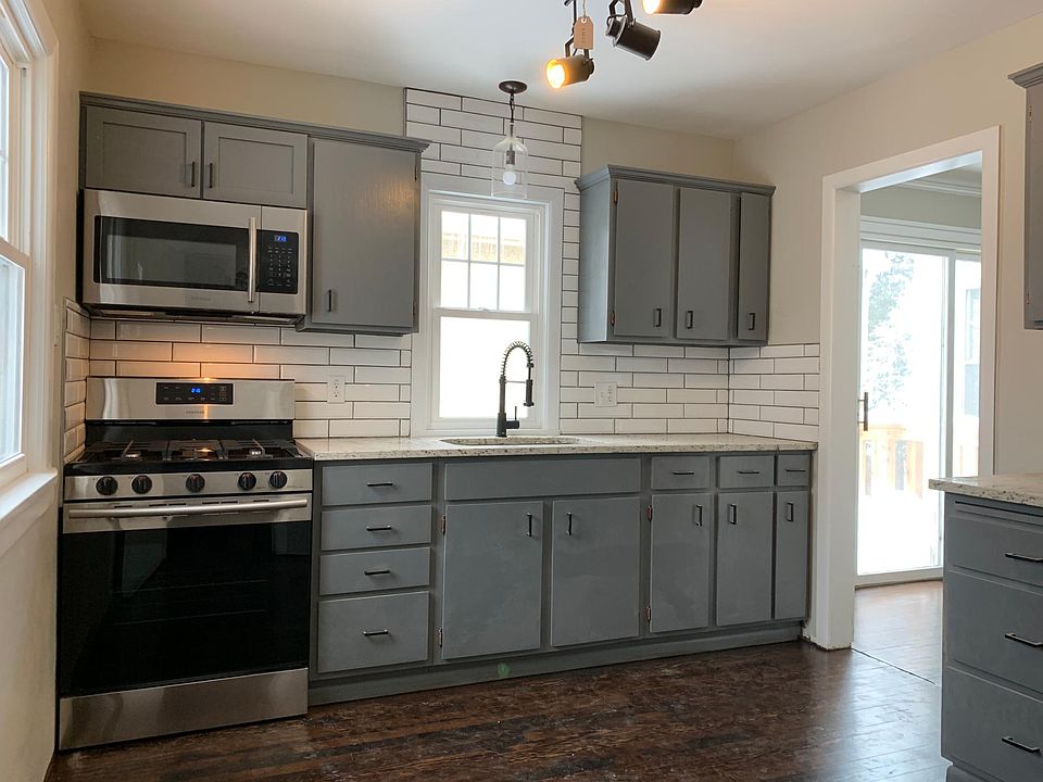 Gourmet kitchen with brand new stainless steel appliances and granite countertops, under mount sink with commercial grade faucet, and portable dishwasher