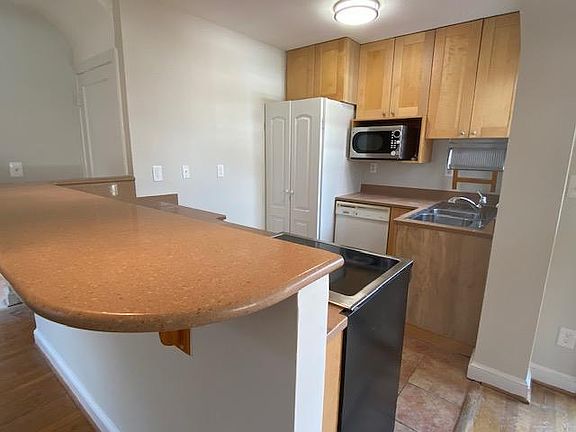 Tile flooring throughout kitchen; sliding doors leads to deck!