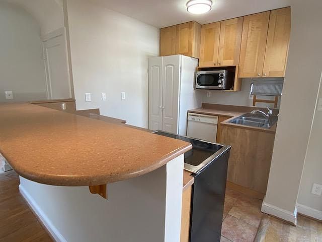 Tile flooring throughout kitchen; sliding doors leads to deck!