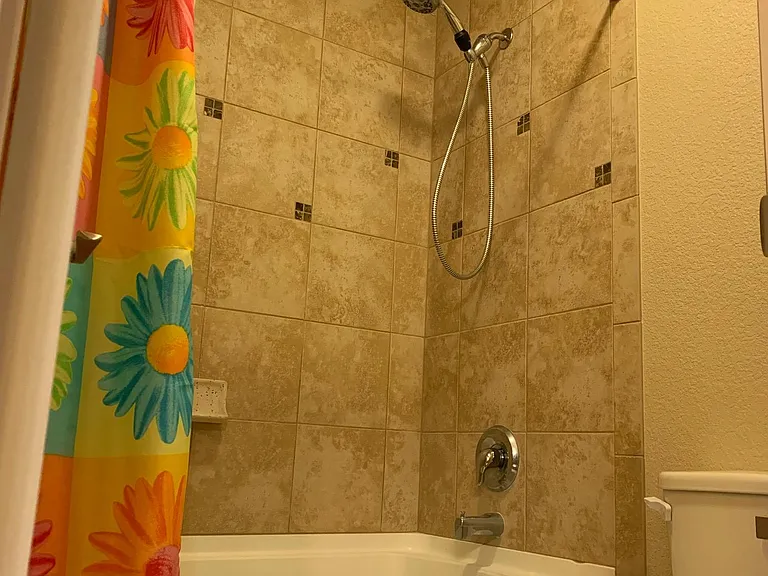 Master bathtub/toilet with extra privacy door. Tub is extra deep soaker-style!