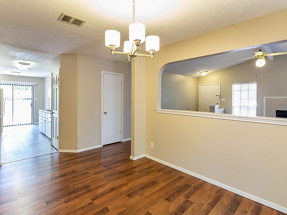 looking from dining to kitchen. two sliding glass doors: on kitchen side and dining room side