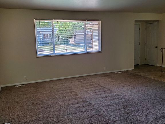 Living room and entryway as viewed from dining area