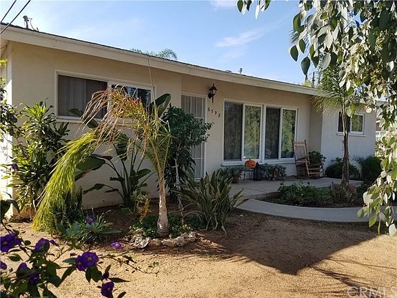 Front of the house from a wider angle.