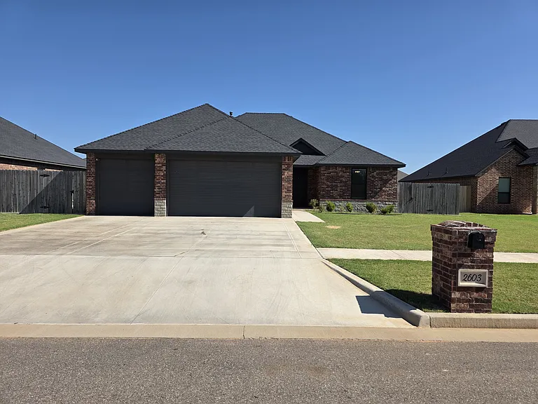 4 bedroom, 2 bath, 3 car garage brick home