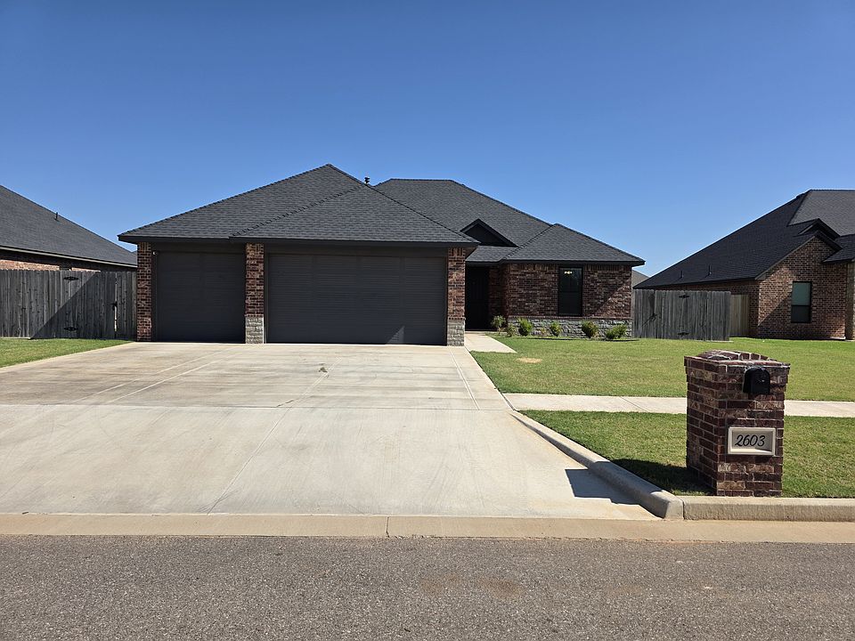 4 bedroom, 2 bath, 3 car garage brick home