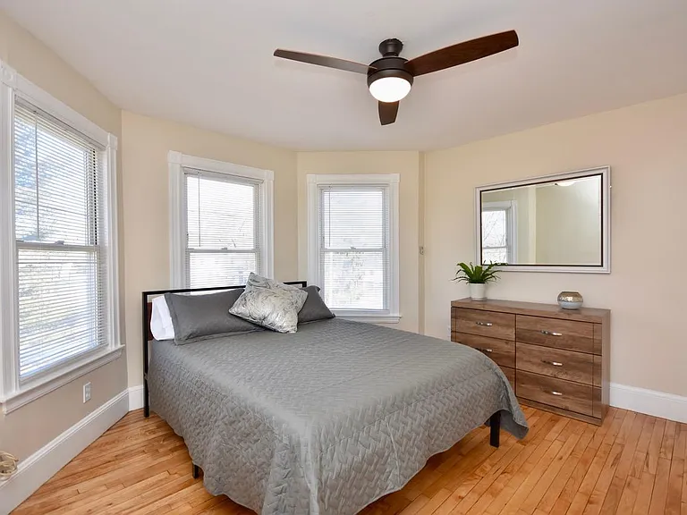 Bedroom with bay window, queen bed, 43" Smart TV, Payson Park and Back Cove View
