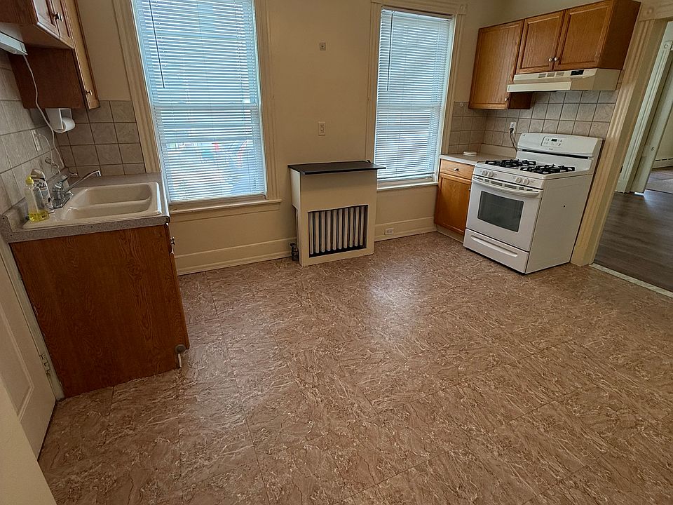 Bright eat-in kitchen with plenty of natural light and a gas stove.