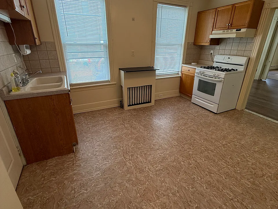 Bright eat-in kitchen with plenty of natural light and a gas stove.