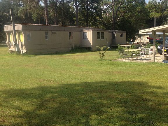 The trailer home in front