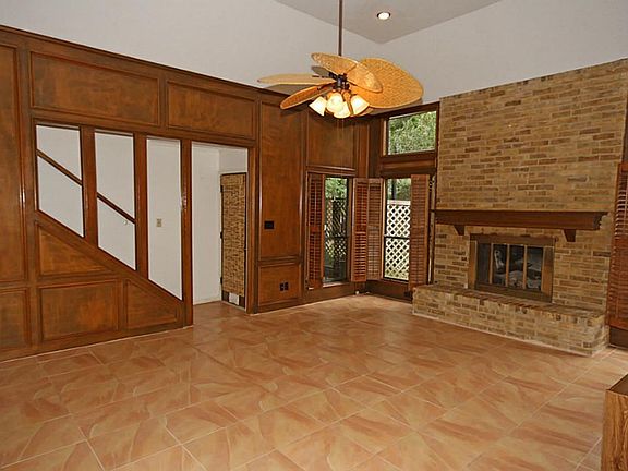Another view of living room and stairs to second floor.