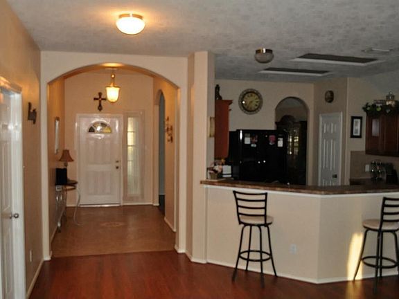 Foyer and Kitchen, all laminate and tile in this home