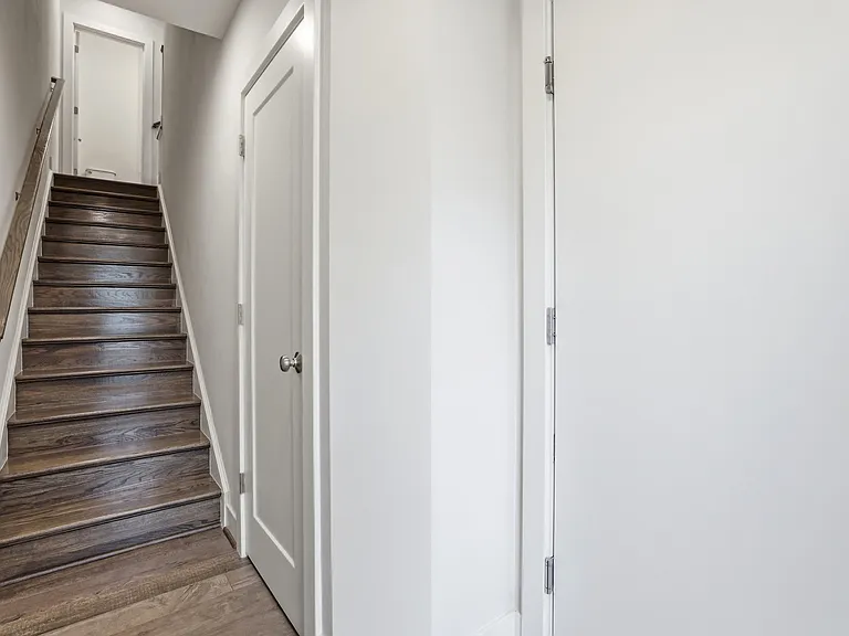 Entry way with garage door, closet, and stairs to main level.