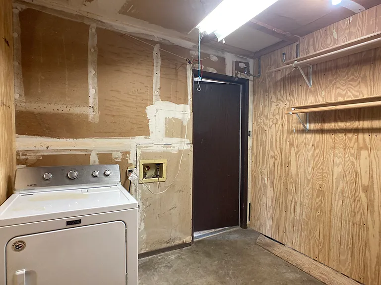 Laundry room off kitchen. Dryer could stay but not maintained by owner.