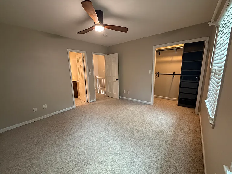 Front bedroom with a full bathroom and closet with built-ins.