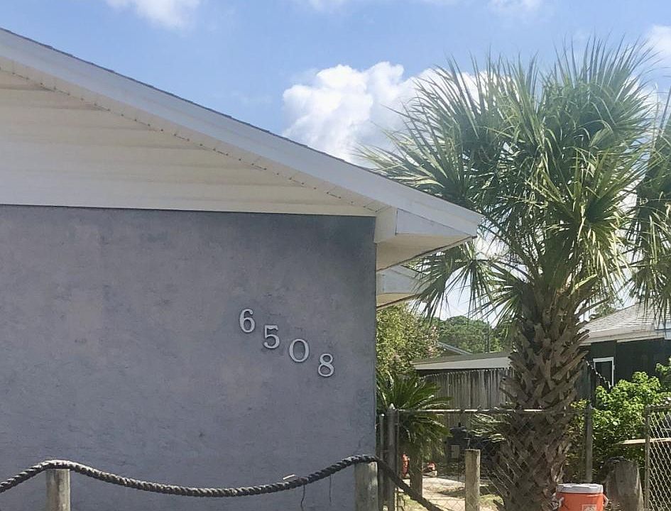 Front with two parking spaces