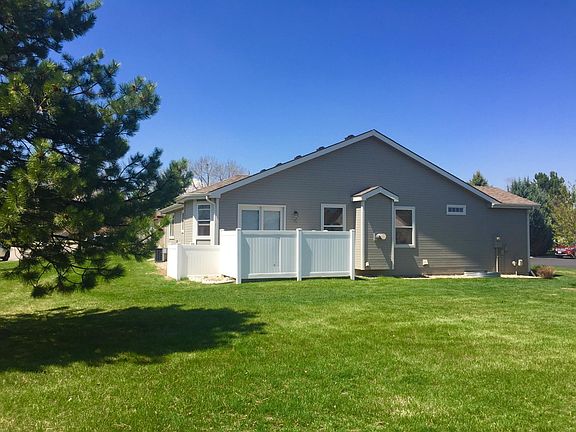 East side of home with vinyl fencing enclosing the patio.