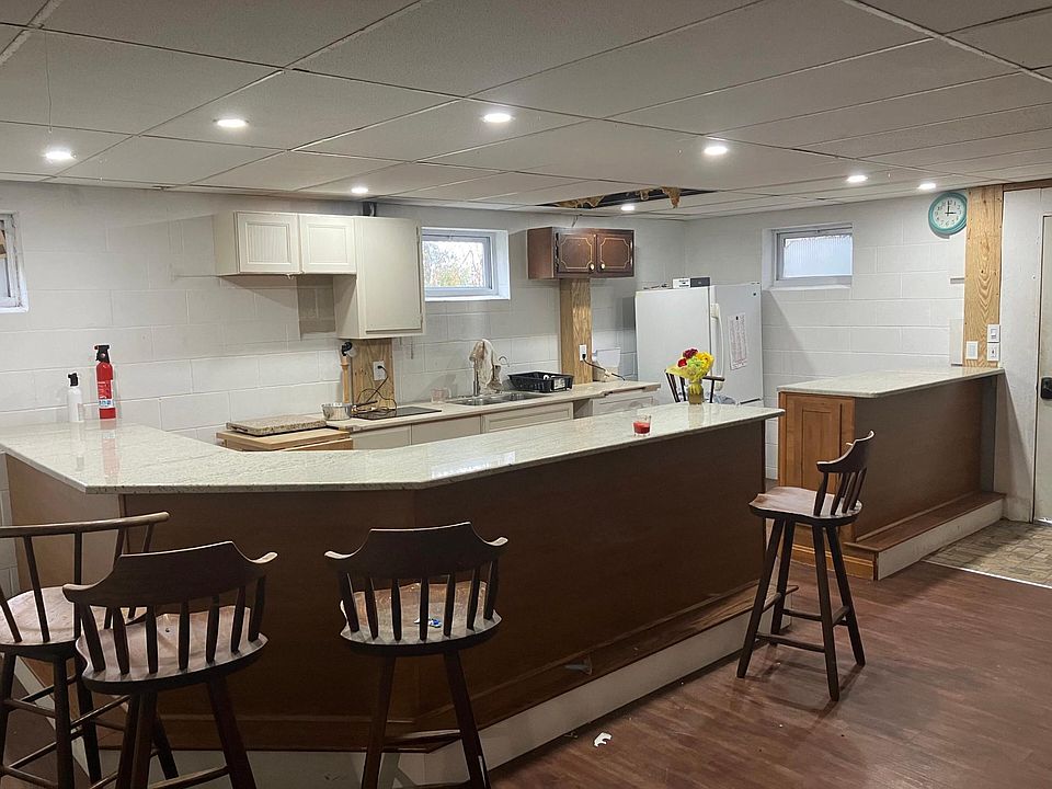 kitchen area seating at counter, buffet area close to finish
