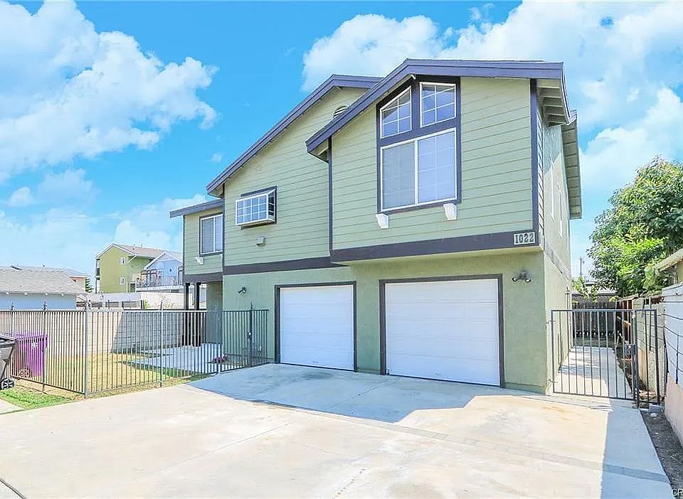 Front of house and two single car garages with automatic openers