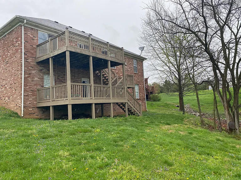 View of the house from behind. Deck will be pressure washed and stained in July 2025.