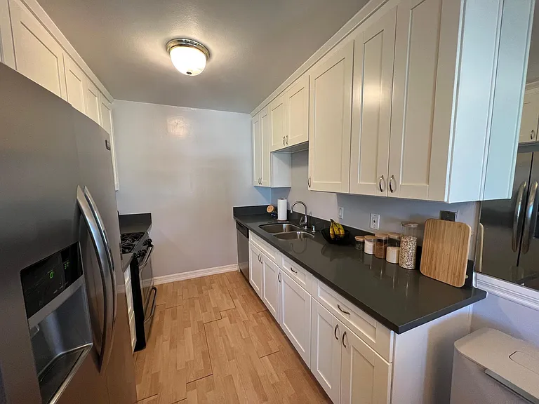 Please note: Pre-renovation photo shown for layout reference. Brand-new flooring has since been installed.