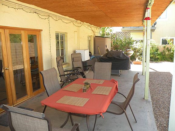 Total enclosed backyard has Covered Patio and includes shed shown at end of patio but does not include patio furniture