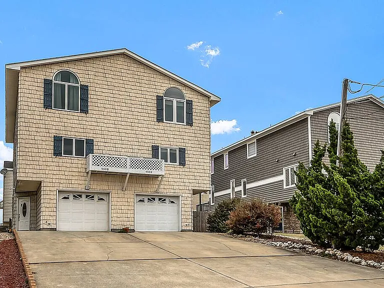 Long driveway with parking for 6 cars.