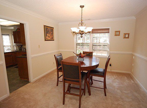 Heavy moldings & pocket door to Kitchen!