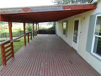 Expansive year round covered deck and front door