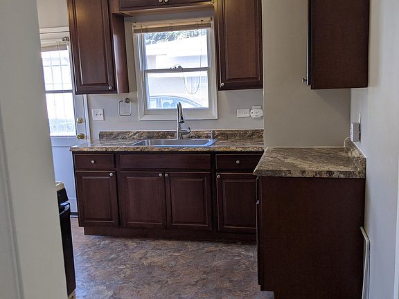 New kitchen cabinets, garbage disposal, countertops, sink and hardware installed 10/15/2020.