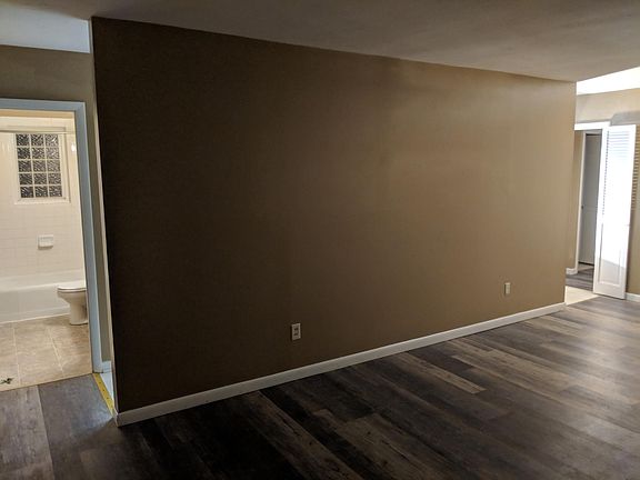 Quick access from living room to bath, kitchen, and hall on