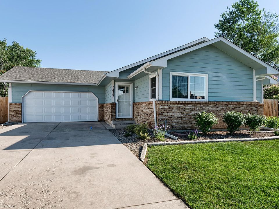 Welcome Home! Double car garage and parking pad.